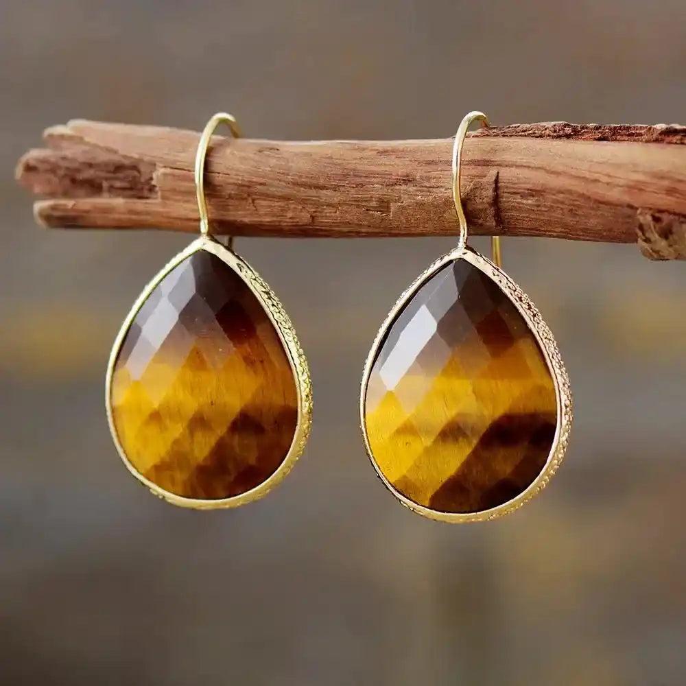 Crystal Destiny Tiger's Eye teardrop dangle earrings with gold-toned hooks, showcasing brown and golden facets.
