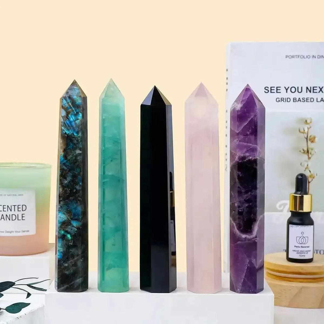 Polished crystal towers in amethyst, rose quartz, and more, standing 150-170mm tall as elegant, healing focal points.