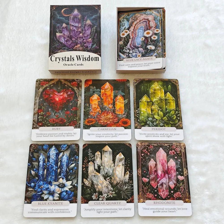 Crystal Wisdom Oracle Cards deck with vibrant illustrations of Ruby, Carnelian, Peridot, Blue Kyanite, Clear Quartz, and Rhodonite.