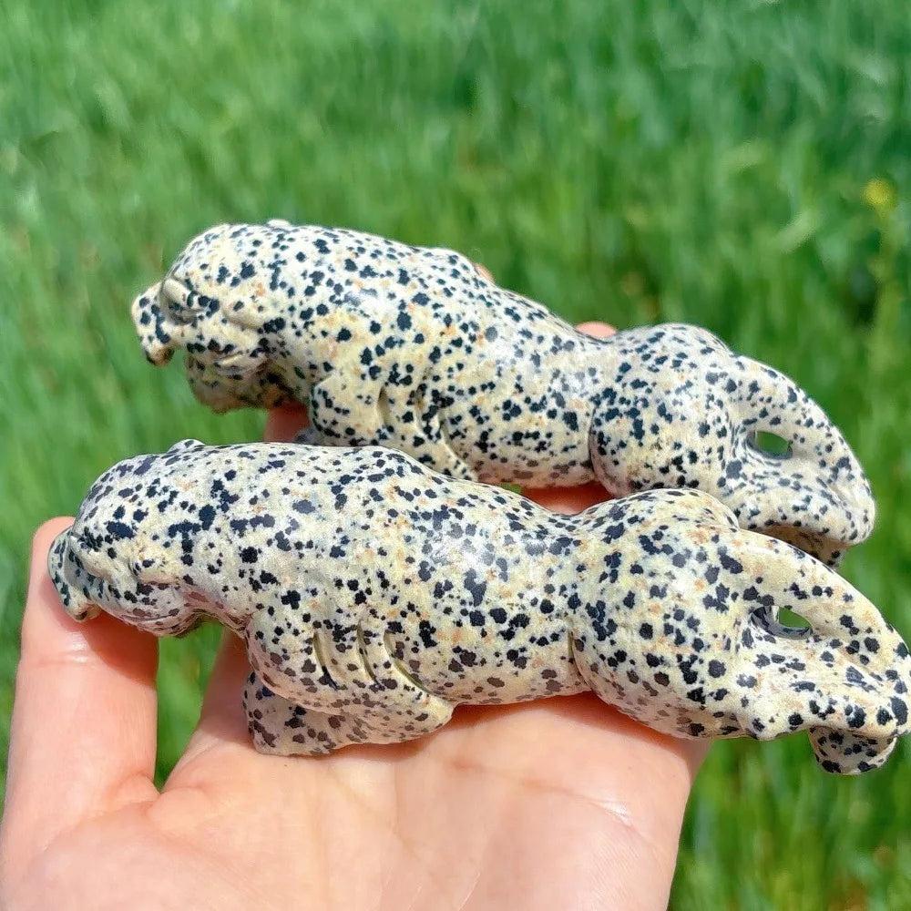 Hand-carved Dalmatian Jasper leopard crystal for grounding, featuring a playful spotted pattern and joyful energy.