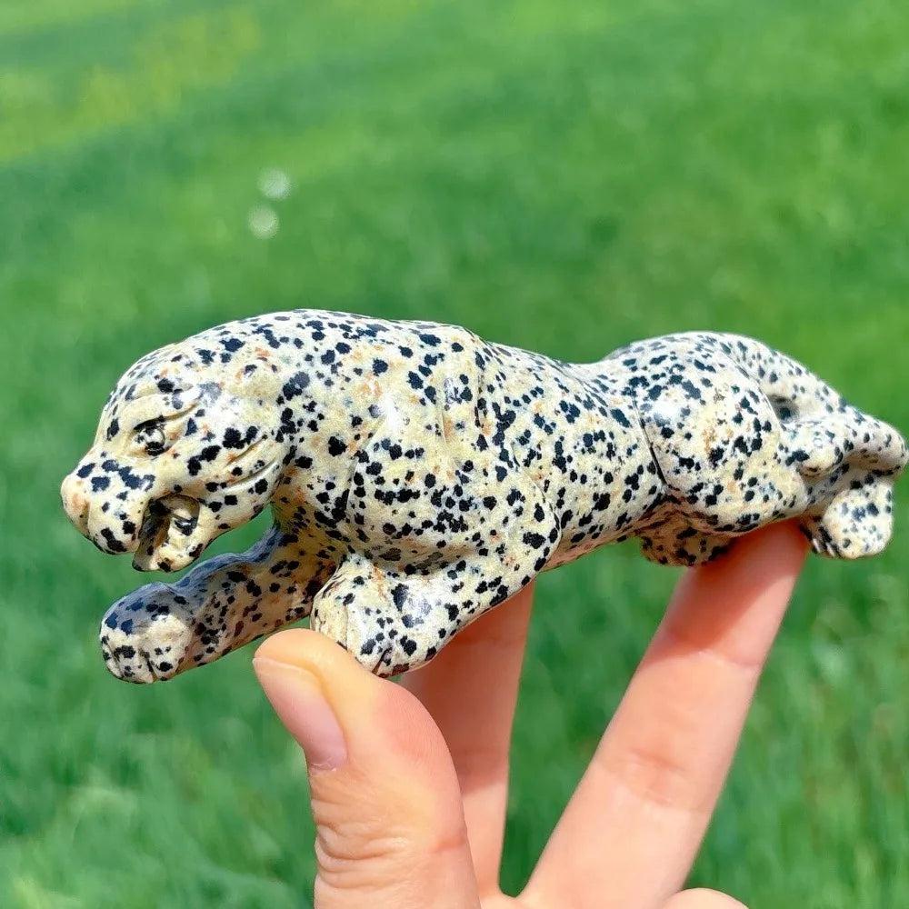 Hand-carved Dalmatian Jasper leopard crystal for grounding, featuring playful black spots and a detailed, joyful design.