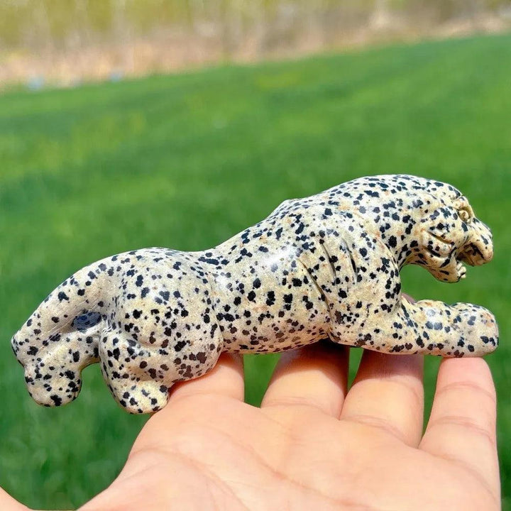 Hand-carved Dalmatian Jasper leopard crystal for grounding, featuring a playful spotted pattern and detailed design.