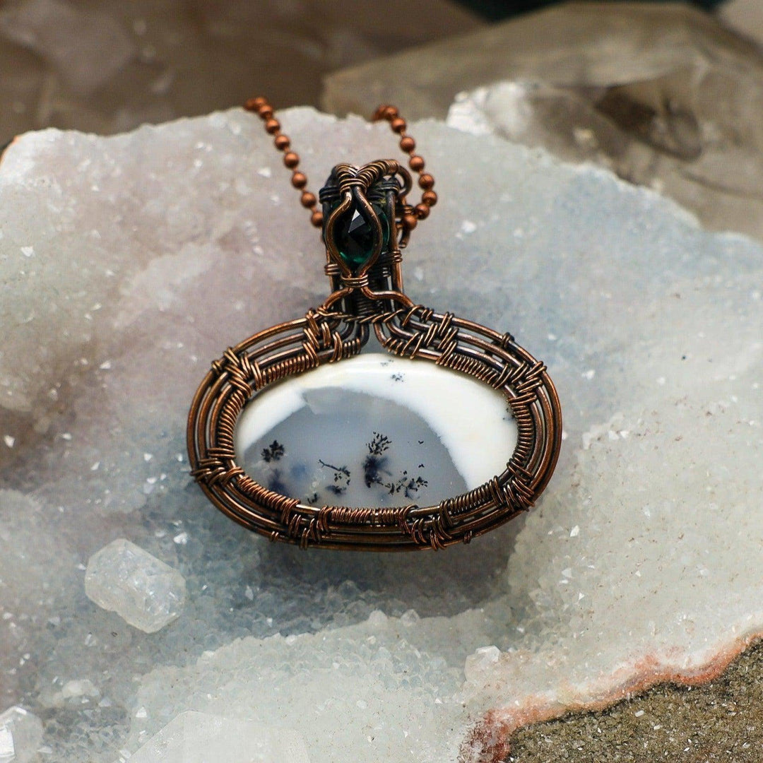 Dendritic Agate Oval Wire Wrap Pendant with tree-like inclusions, wrapped in healing copper, attracting abundance.