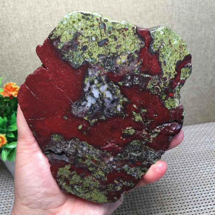 Polished Dragon Blood Jasper freeform slice with deep red and green patterns for grounding and courage.
