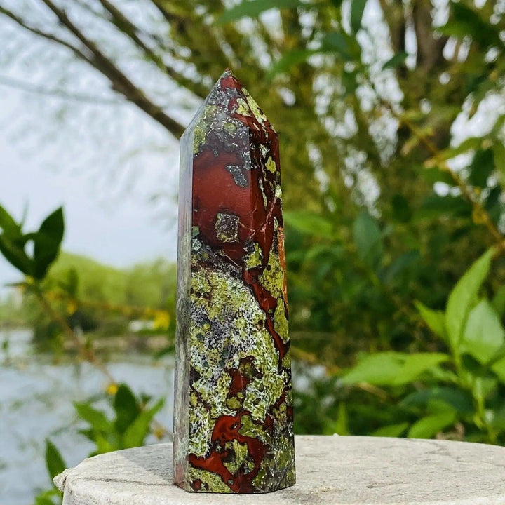 Dragon Blood Stone Crystal Tower Obelisk: Deep forest green with vivid red, a powerful healing point for courage and growth.