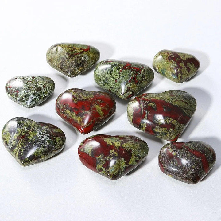 Polished green and red dragon bloodstone crystal heart worry stones for spiritual healing.