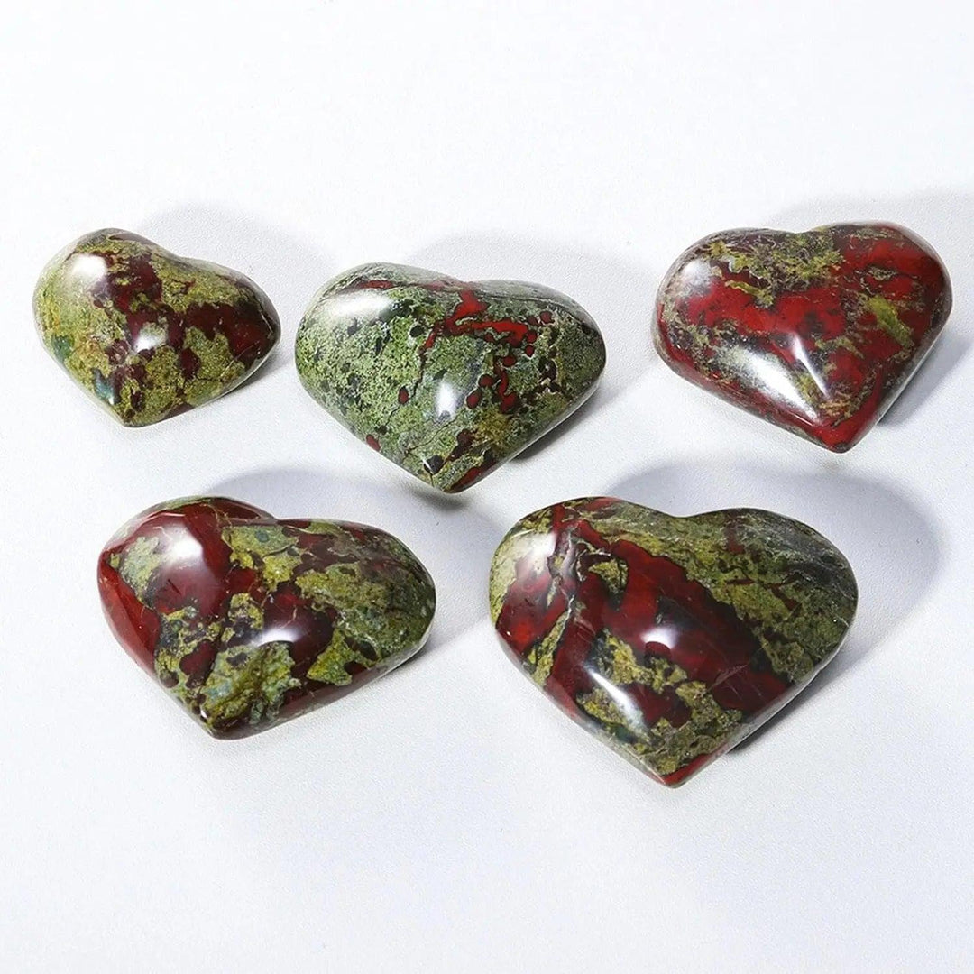 Polished green and red dragon bloodstone crystal heart worry stones for spiritual healing.