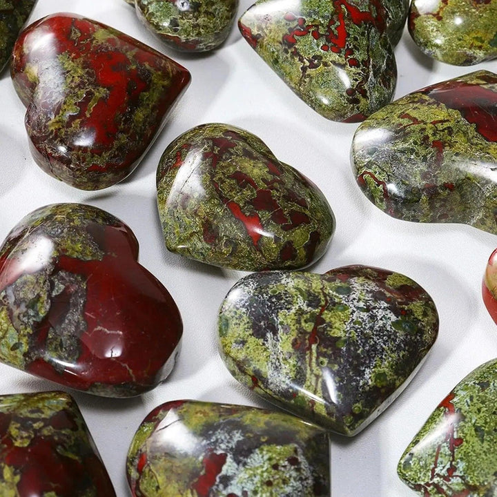 Polished green and red dragon bloodstone crystal hearts for spiritual healing.