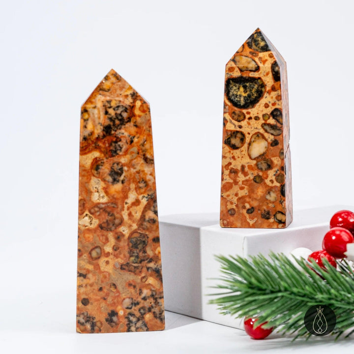 Hand-carved 6–8cm & 8–10cm Natural Dragon Palace Relic Tower crystal, a healing stone with unique brown and black patterns.