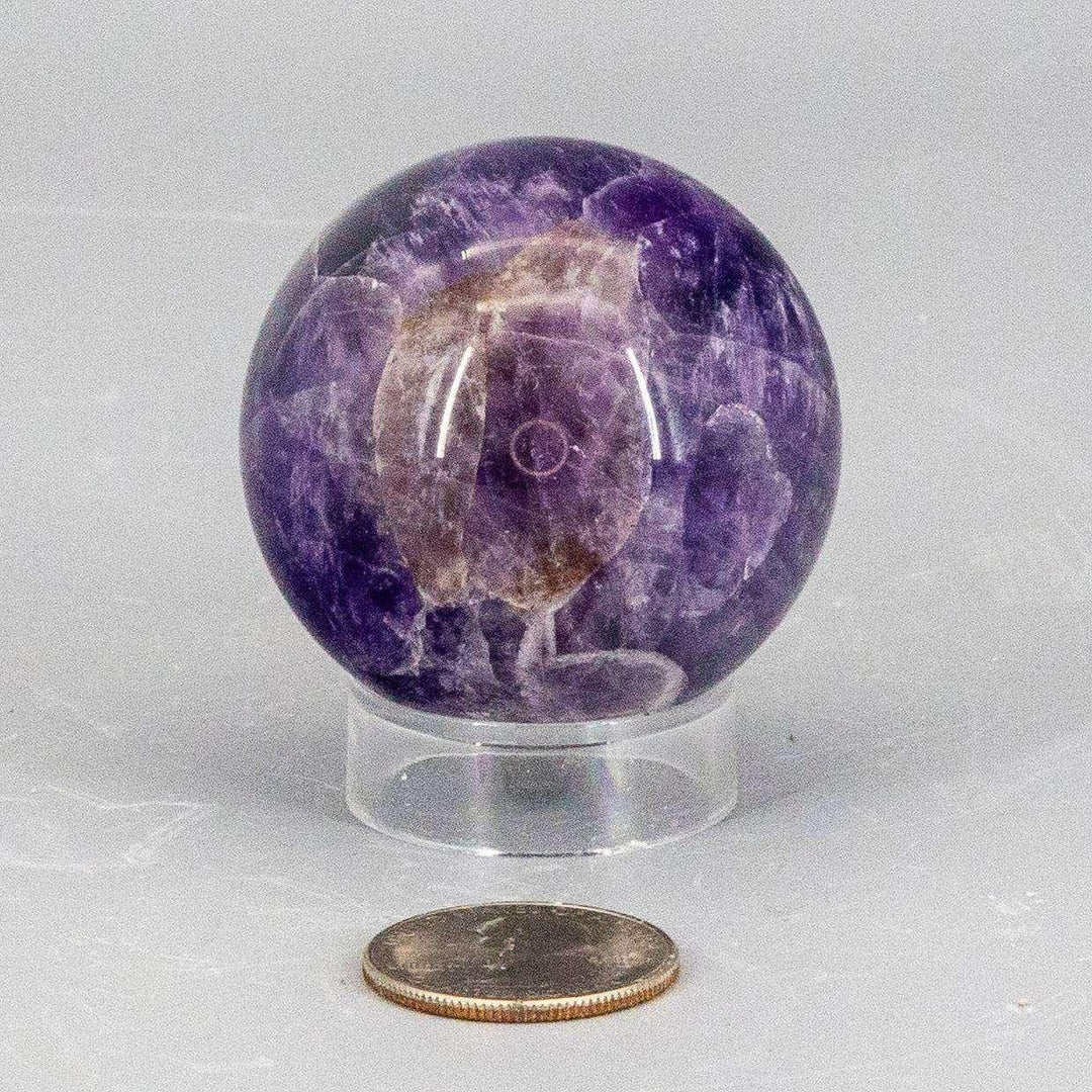 Dream Amethyst Sphere, 49mm, showcasing layered purple and white banding for a serene, dreamy appearance.