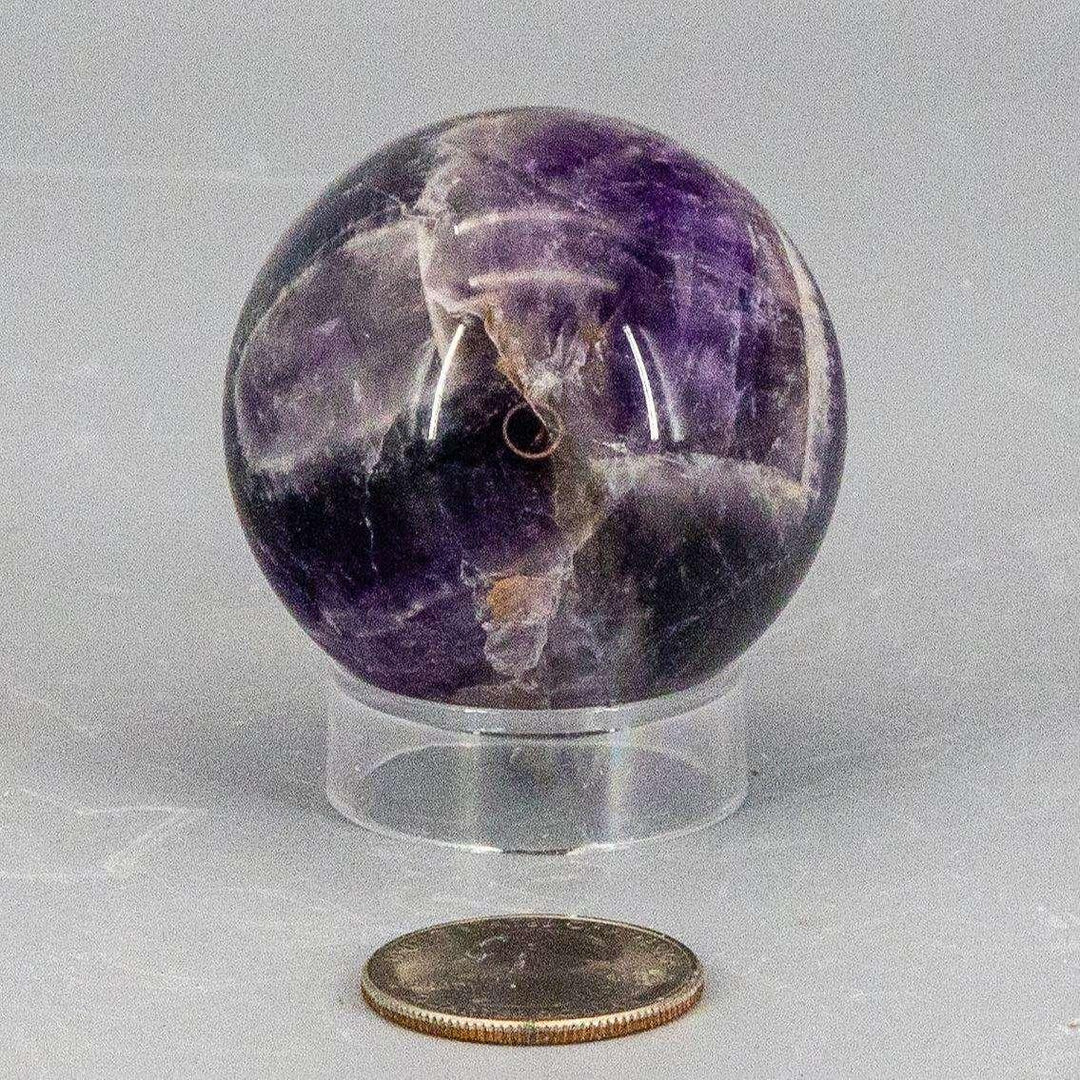 Dream Amethyst Sphere, 49mm, showcasing layered purple and white banding for a visually soft, complex look.