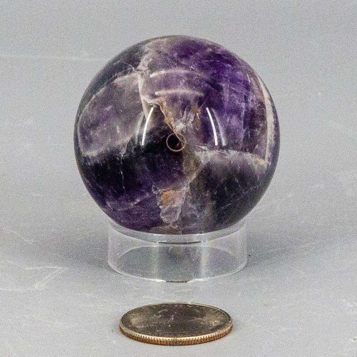 Dream Amethyst Sphere, 49mm, showcasing layered purple and white banding for a visually soft, complex look.
