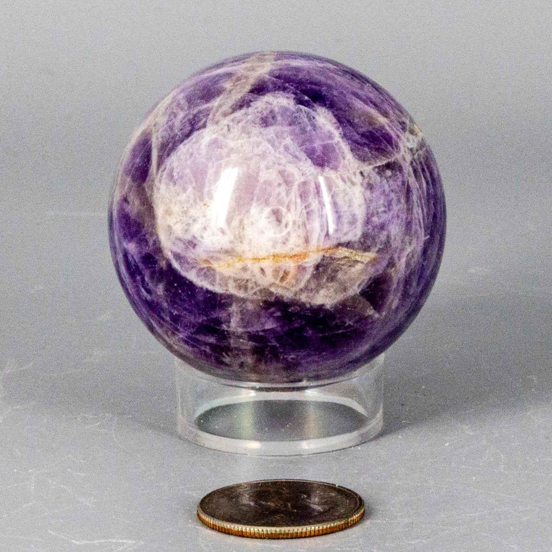 Dream Amethyst Sphere, 51-57mm, showcasing soft purple and white bands, radiating calming energy.