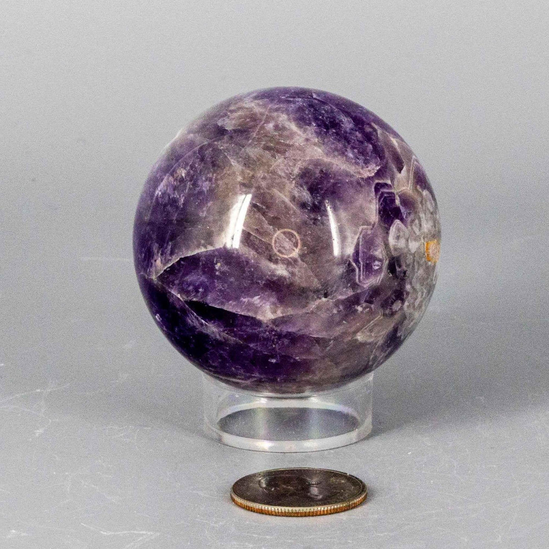 Dream Amethyst Sphere, 51-57mm, showcasing soft purple and white bands, radiating calming energy.