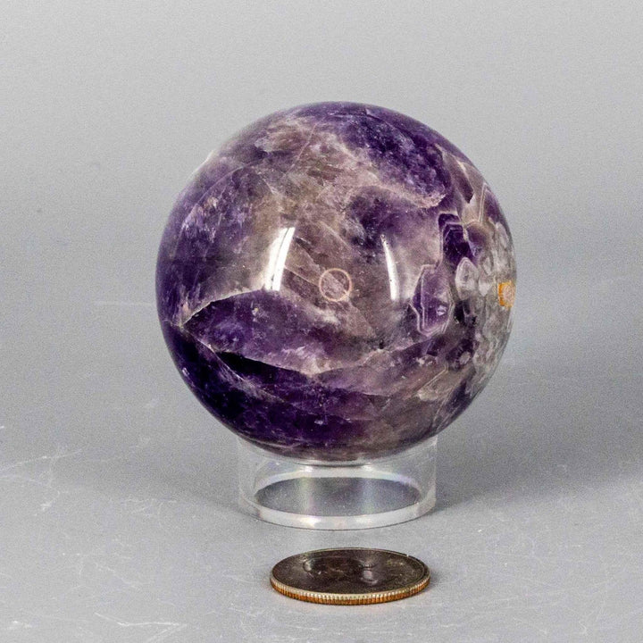 Dream Amethyst Sphere, 51-57mm, showcasing soft purple and white bands, radiating calming energy.