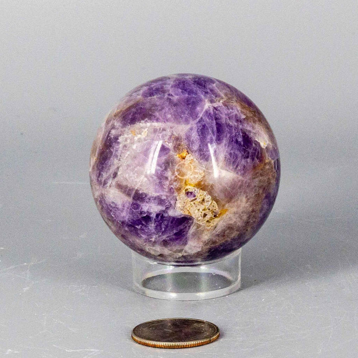 Dream Amethyst Sphere, 51-57mm, showcasing soft purple and white bands for calming energy and restful sleep.