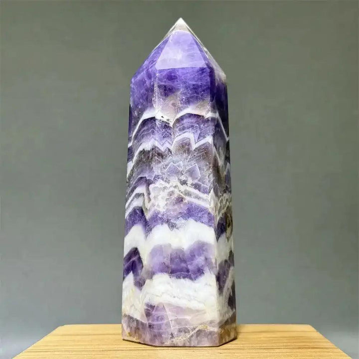 Polished Dream Amethyst obelisk tower with lavender, purple, and white chevron patterns for crown chakra meditation.