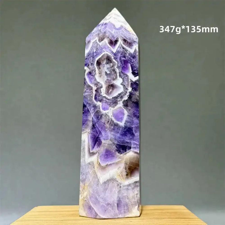 Dream Amethyst polished obelisk tower with lavender and deep purple chevron patterns for crown chakra healing.
