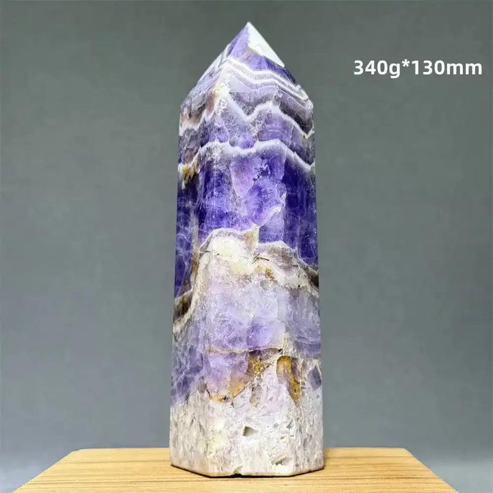 Dream Amethyst polished obelisk tower featuring deep purple and lavender bands with gold accents for crown chakra healing.