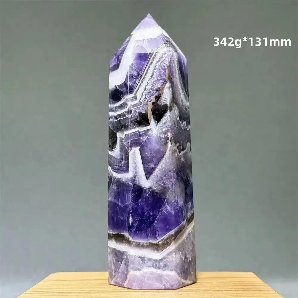 Dream Amethyst polished obelisk tower featuring deep purple and lavender chevron patterns for crown chakra healing.