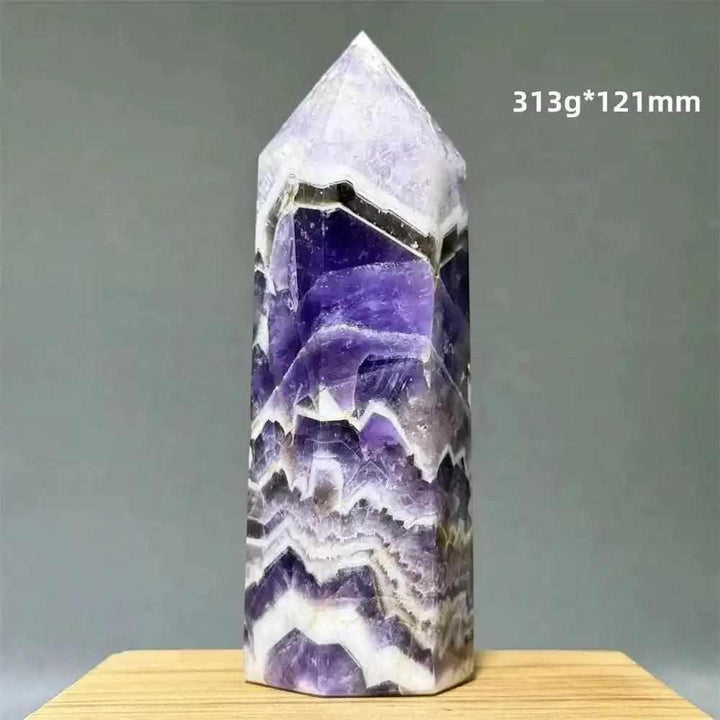 Dream Amethyst polished obelisk tower with lavender and deep purple chevron patterns for crown chakra meditation.