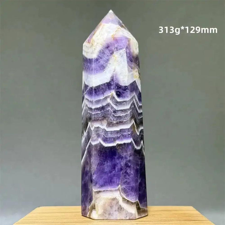 Dream Amethyst polished obelisk tower featuring deep purple and white chevron patterns for crown chakra meditation.
