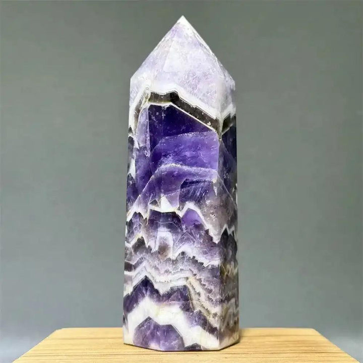 Dream Amethyst polished obelisk tower with lavender and deep purple chevron banding for crown chakra healing and display.