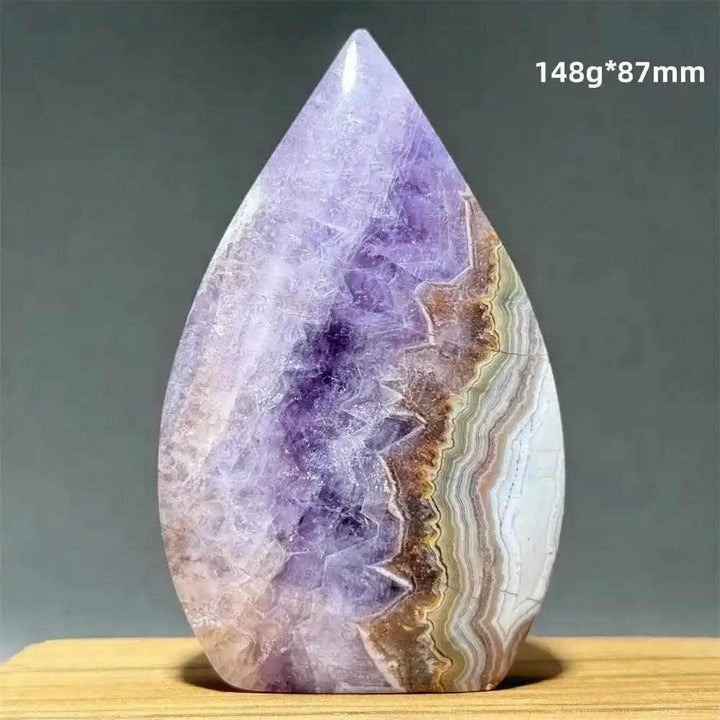 Polished Dream Amethyst torch freeform featuring deep purple crystal swirls and banded white quartz for intuition.