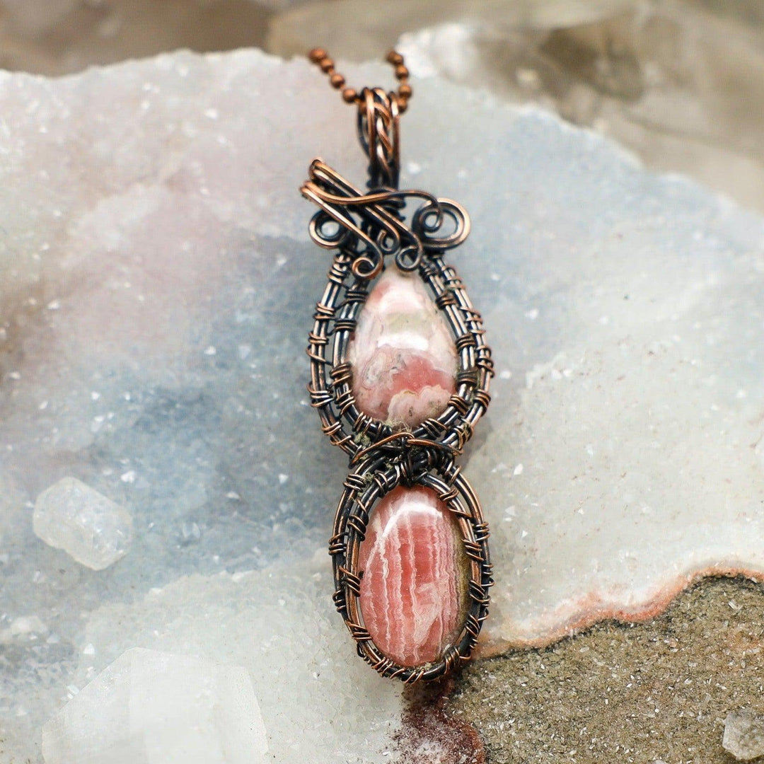 Dual Rhodochrosite Wire Wrap Pendant 3.25" with two pink and cream banded crystals in healing copper wire.