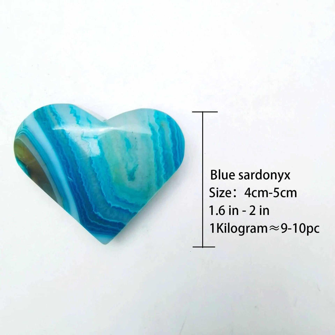 Polished blue agate heart palm stone with vivid natural banding, perfect for Throat Chakra healing and calming energy.