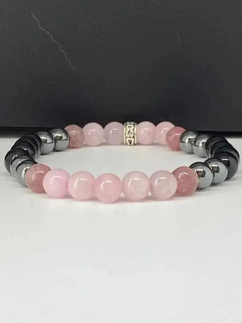 Crystal Destiny Empath Protection Bracelet with polished pink Rose Quartz and dark Hematite beads.