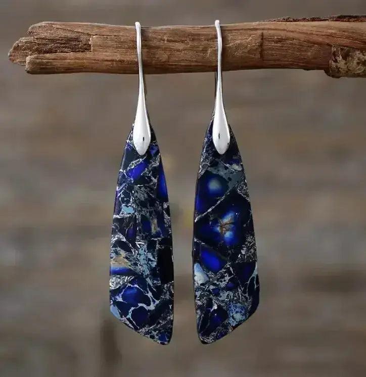 Empire Jasper Teardrop Earrings: Bohemian crystal drops with deep blue, white, and black swirling patterns, hung from silver hooks.