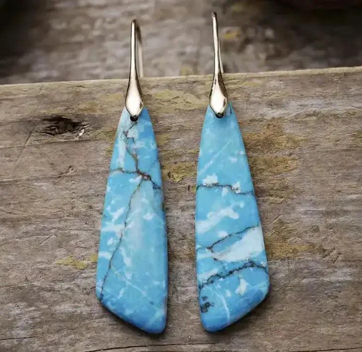 Empire Jasper Teardrop Earrings: Bohemian crystal drops with unique blue, white, and brown patterns for grounding and creative flow.