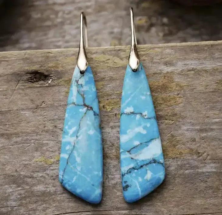 Empire Jasper Teardrop Earrings: Bohemian crystal drops with unique blue, white, and brown patterns for grounding and creative flow.