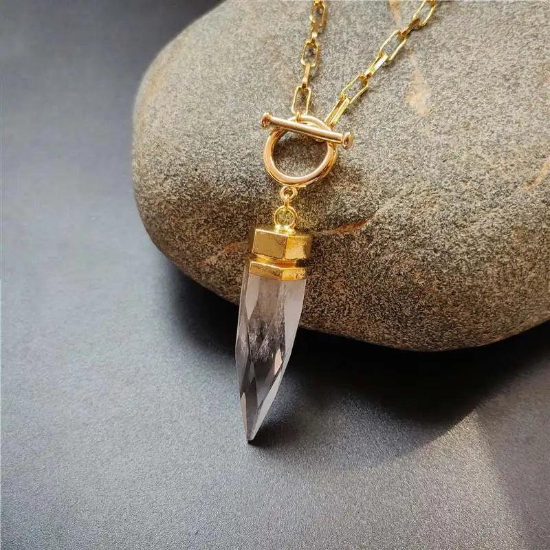 Clear natural crystal quartz spike pendant necklace with a gold-tone OT buckle and vintage chain.