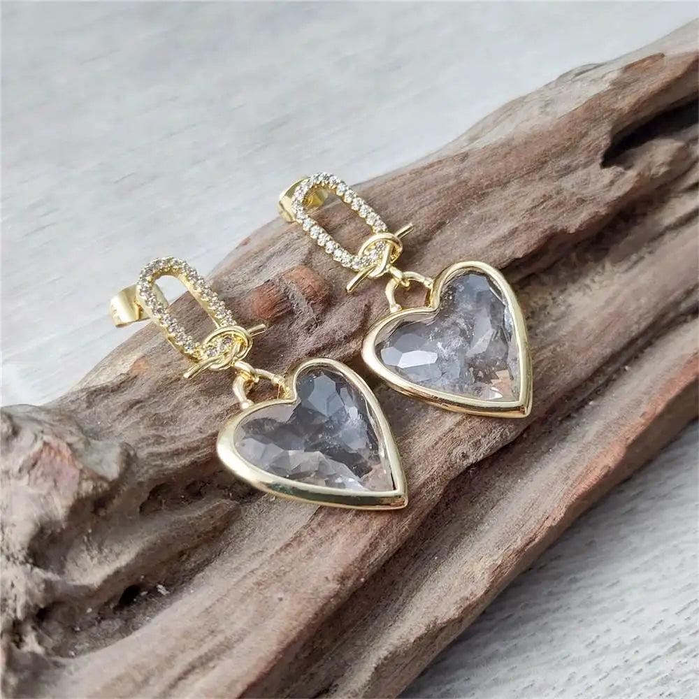 FUWO Handcraft Natural Clear Quartz Heart Shaped Faceted Crystal Earrings with gold-tone accents and sparkling cubic zirconia.