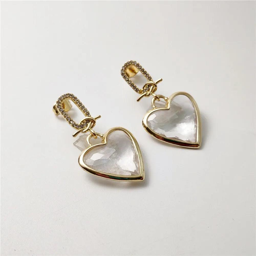 FUWO Handcraft Natural Clear Quartz Heart Shaped Faceted Crystal Earrings with gold-tone accents and sparkling cubic zirconia.