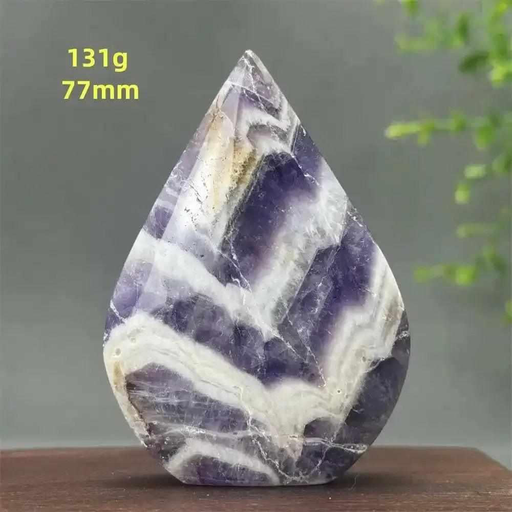Fantasy Amethyst torch freeform with layered purple and white quartz, polished into a flame shape for calming intuition.