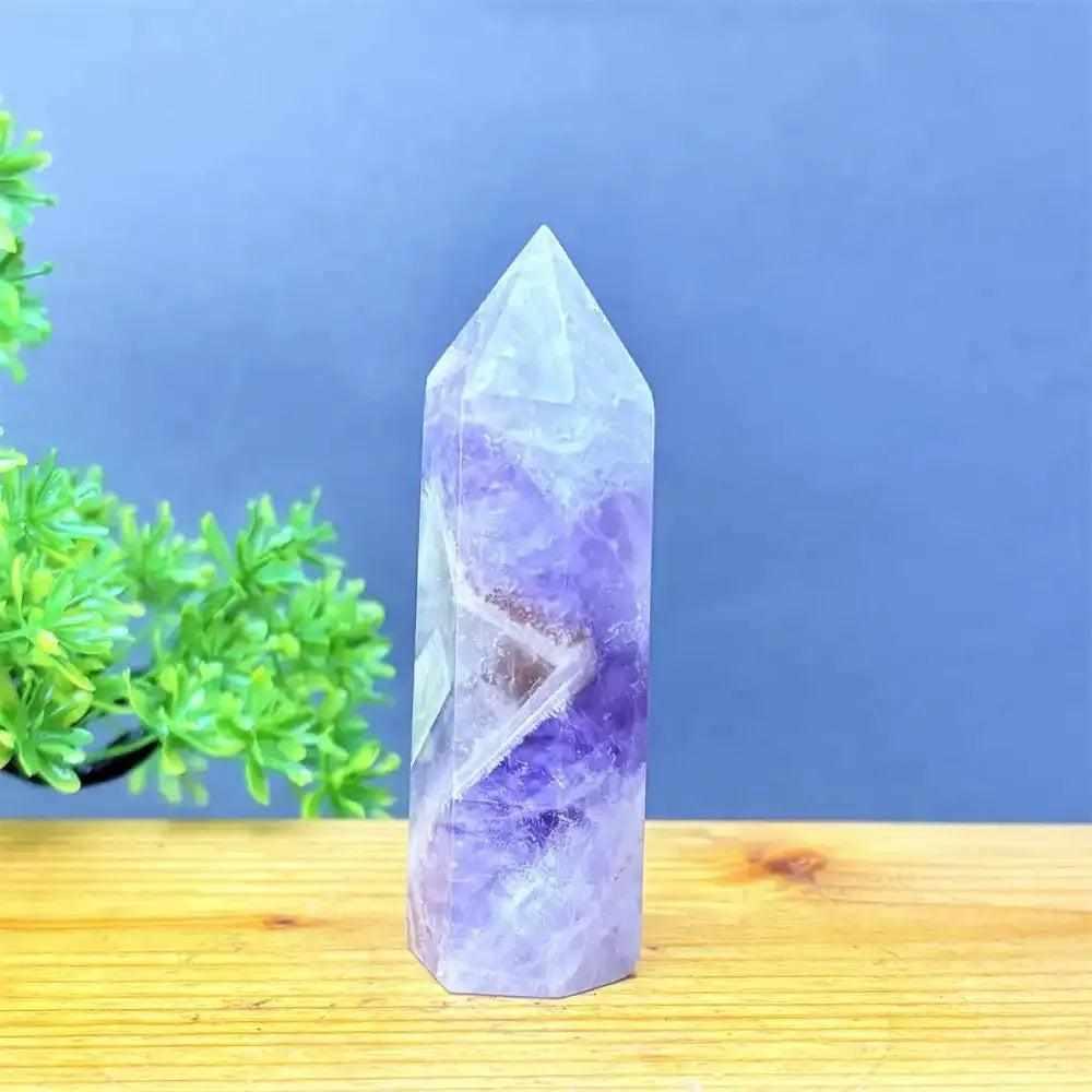Hand-polished Fantasy Amethyst tower featuring layered purple and white quartz for meditation and Crown chakra healing.