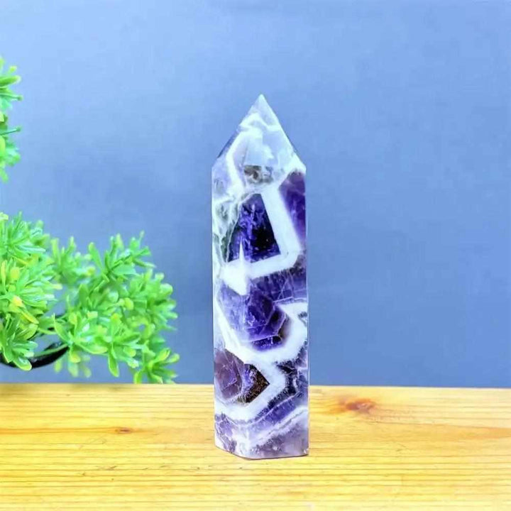 Hand-polished Fantasy Amethyst tower featuring layered purple and white quartz for Third Eye chakra meditation.