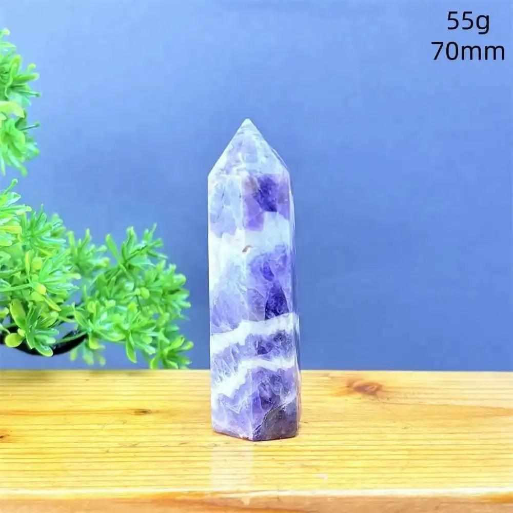 Fantasy Amethyst tower with purple and white quartz layers, a faceted point for meditation, and calming crystal energy.
