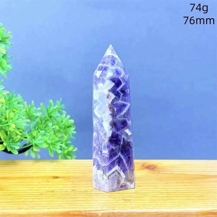 Fantasy Amethyst tower featuring layered purple and white quartz, a faceted point for meditation, 76mm tall, 74g.