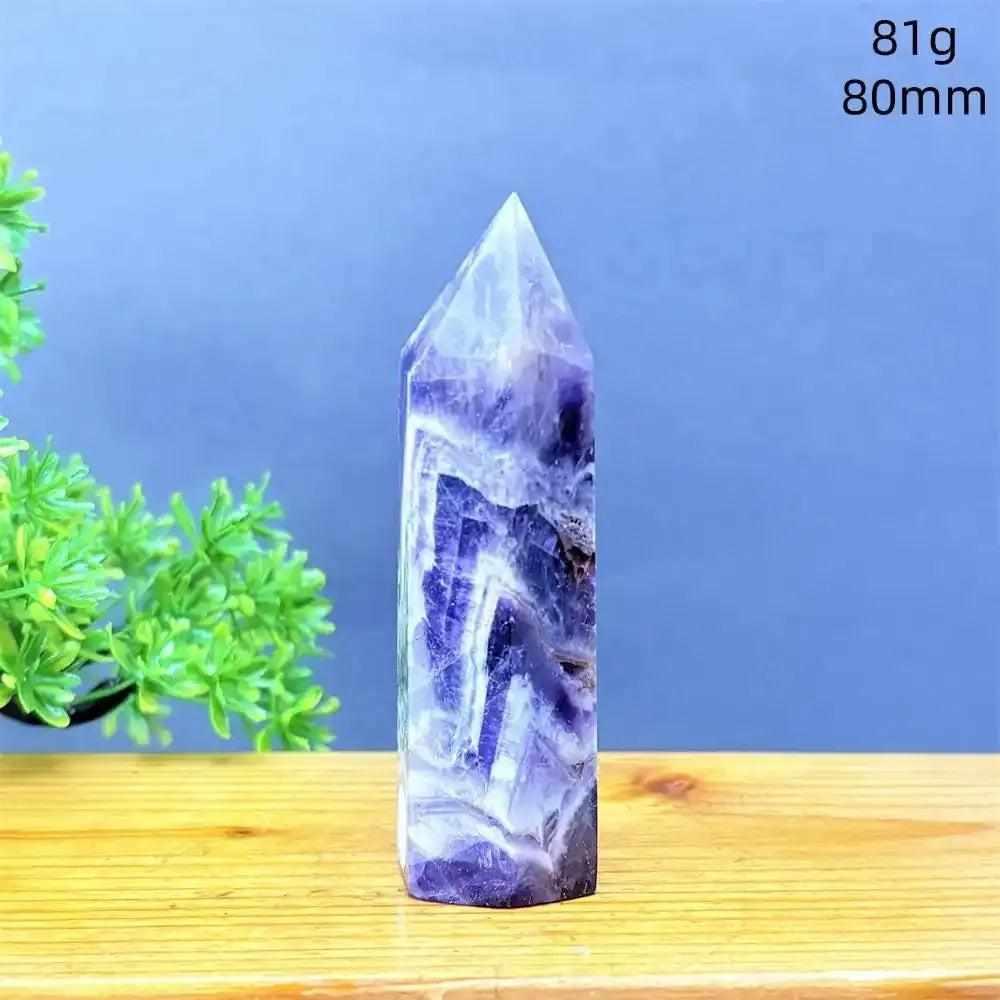 Fantasy Amethyst tower with purple and white quartz layers, a faceted point for meditation and Crown Chakra energy.
