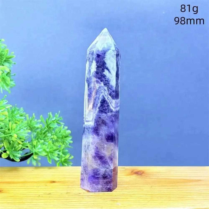 Fantasy Amethyst tower with purple and white quartz layers, a faceted point for meditation, and calming energy.