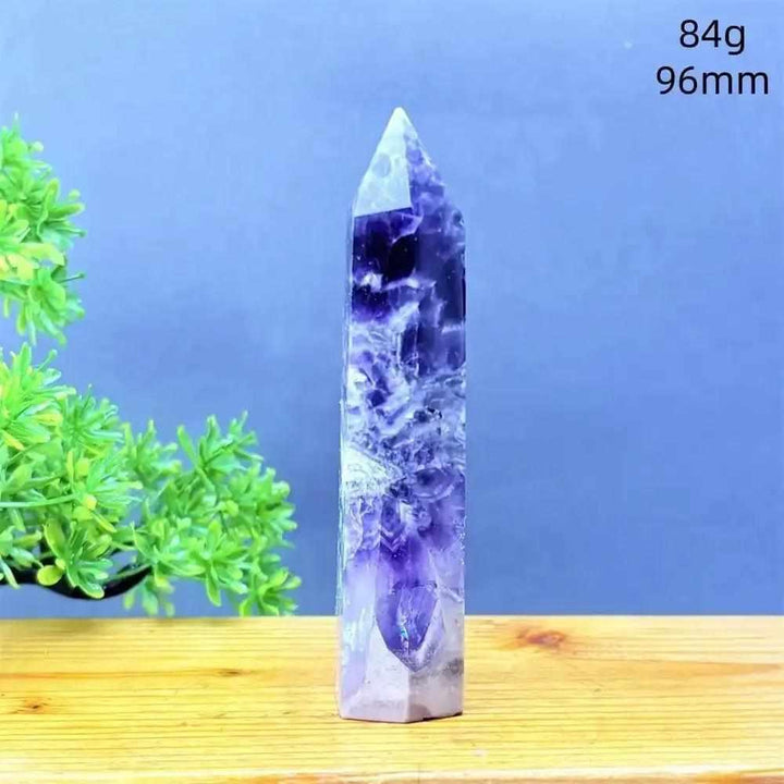 Fantasy Amethyst tower with purple and white quartz layers, a faceted point, and calming energy for meditation.