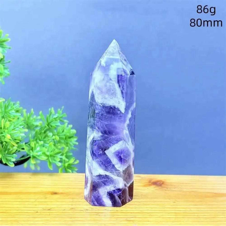 Fantasy Amethyst tower with layered purple and white quartz, a faceted point for meditation and Third Eye chakra energy.