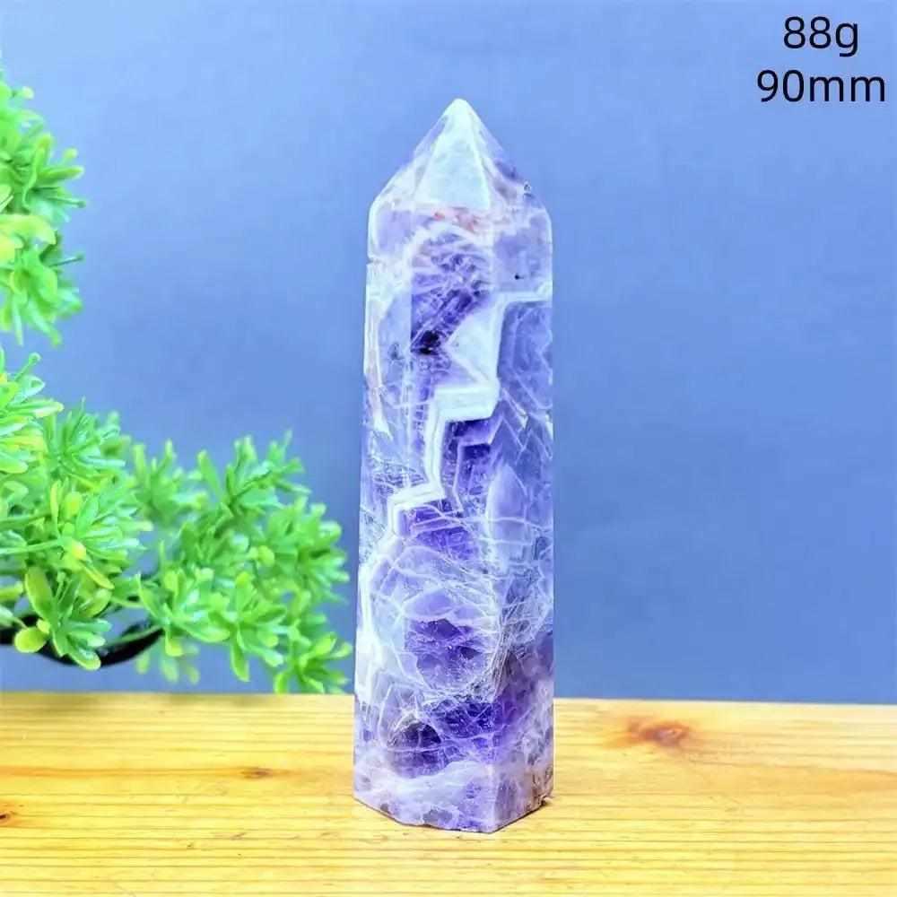 Fantasy Amethyst tower with purple and white quartz layers, a faceted point for meditation, and calming crystal energy.
