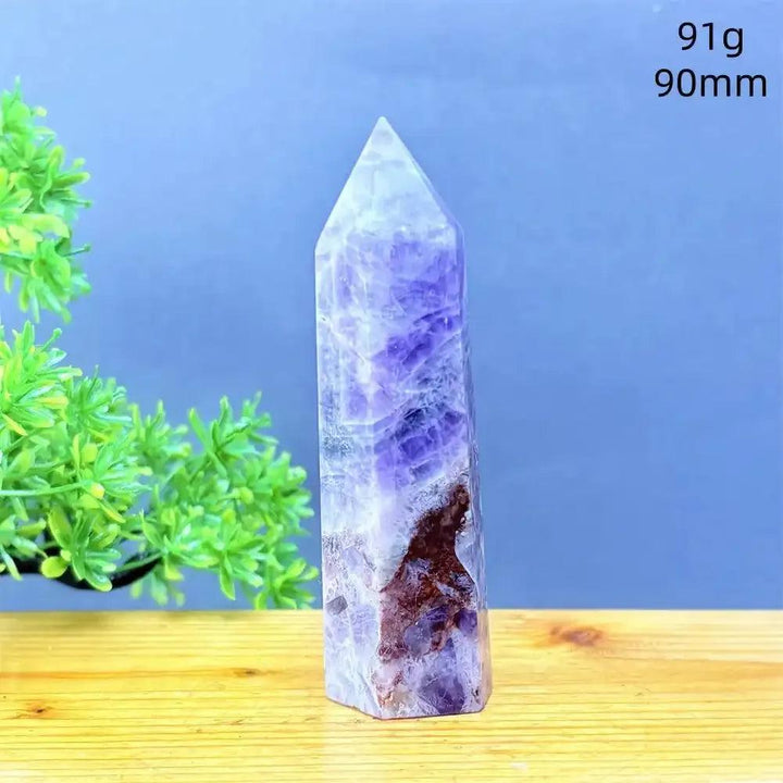 Hand-polished Fantasy Amethyst tower with purple and white quartz layers, perfect for meditation and spiritual calm.