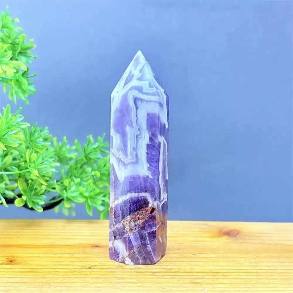 Fantasy Amethyst tower with layered purple and white quartz, featuring a polished faceted point for meditation.
