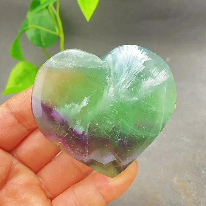 Polished Feather Fluorite Crystal Heart, showcasing stunning bands of purple, green, and clear tones for mental clarity.